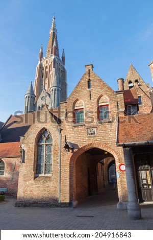 Bruges - Church of Our Lady from yard of Saint John Hospital (Sint Janshospitaal)  in evening light
