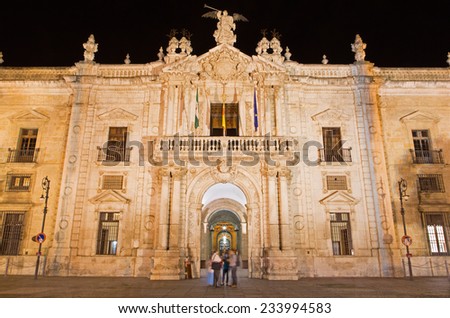 Seville - The facade of University fromer Tobacco Factory at night.