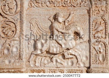 VERONA - JANUARY 27: Relief of rider on the facade of romanesque Basilica San Zeno. Reliefs is work of the sculptor Nicholaus and his workshop on January 27, 2013 in Verona, Italy.