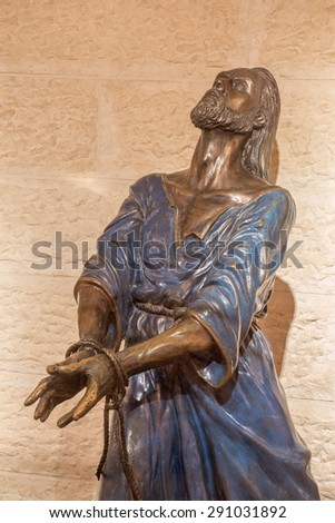 JERUSALEM, ISRAEL - MARCH 3, 2015: The bronze statue of Servus Domini (The Servant of The Lord) or  (imprisoned Jesus) in Church of St. Peter in Gallicantu by  by Israels sculptor Richard Shiloh.