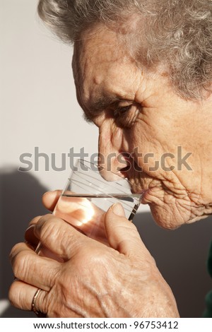 old woman and glass of water