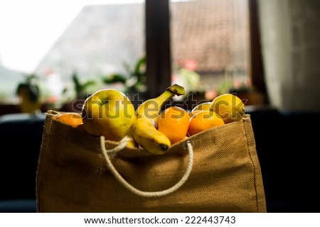 Grocery bag full of fruits.