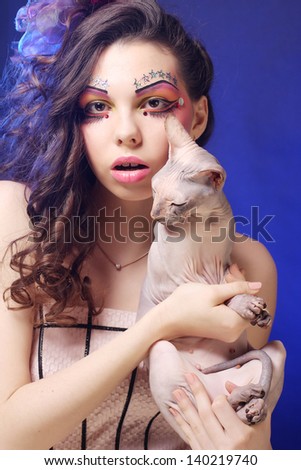 young princess with Sphynx cat. creative fantasy make-up.