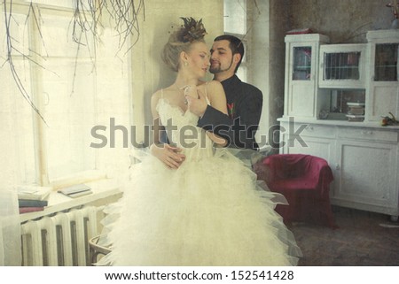 Bride and groom in vintage autumn room