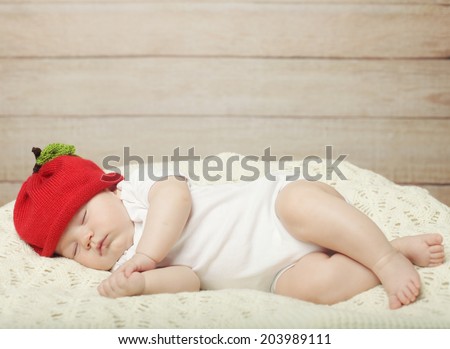 The sweet dream of baby in red hat