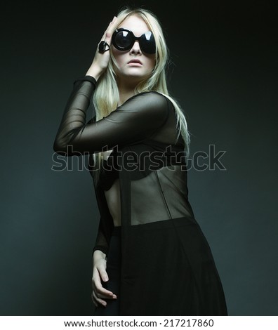 fashion blond woman posing in black lingerie