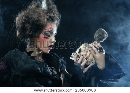 Picture a beautiful fantasy woman with skull. Halloween theme. Party theme.