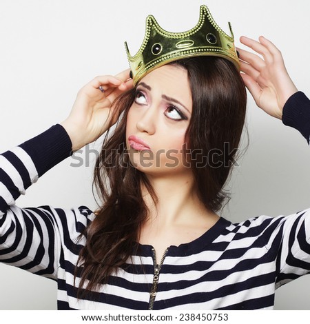 Happy young woman with crown