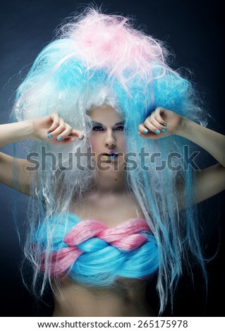 model with bright make up and colorful hair