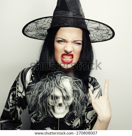 Funny Witch with skull. Holiday picture.