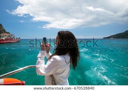 Similar – Image, Stock Photo Woman photographing rocky formations on smartphone