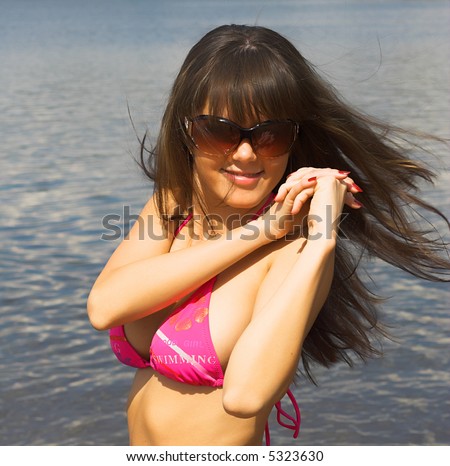 Attractive girl at beach having fun in the sun