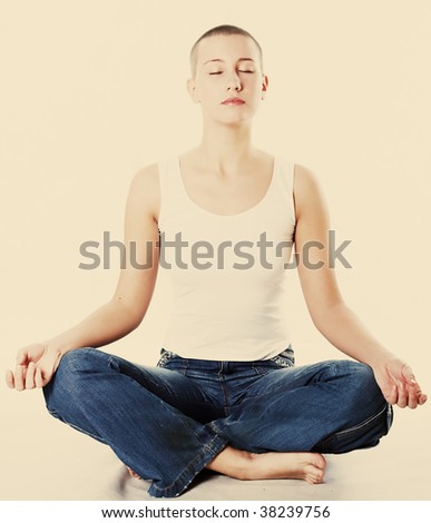 Yoga, young beautiful woman with close eyes.Warm yellow tones.
