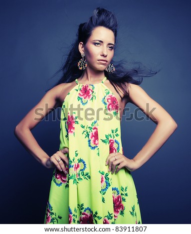 Fashion model in bright  dress