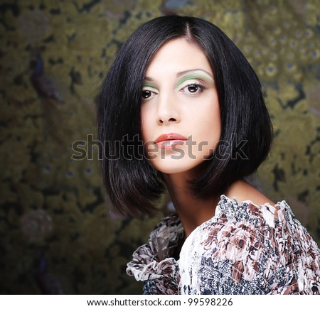 Portrait of young beautiful woman with short dark hair
