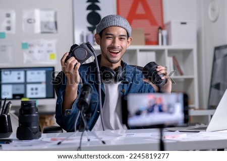 Similar – Image, Stock Photo Man filming a vlog with camera in the city