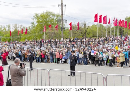 SAMARA, RUSSIA - MAY 9, 2015:  Procession of the people in Immortal Regiment on annual Victory Day, May, 9, 2015 in Samara, Russia