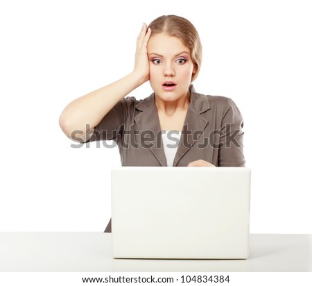 young girl in a horror crying in front of the monitor laptop