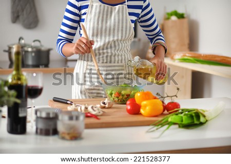 woman  mixing fresh salad
