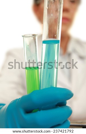 A medical or scientific researcher or doctor holding  a test tube , isolated on white background