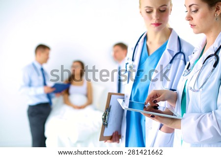 Young woman  doctor holding a tablet pc