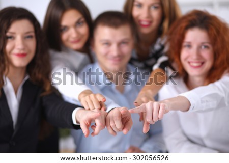 Business people group team point finger at you