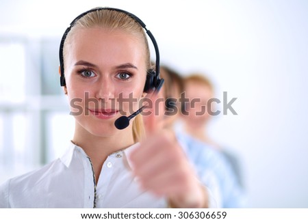 Smiling customer service girl showing ok, isolated on white background.