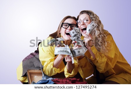 Incredibly happy screaming girls with money win