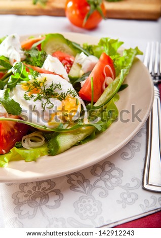 Fresh healthy food. Light green salad with pouched egg