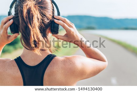 Similar – Image, Stock Photo Woman with headphones before working out in park