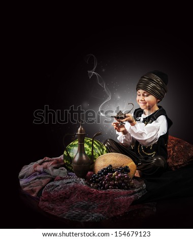 Magic scene : little boy causes of gin from old Lamp