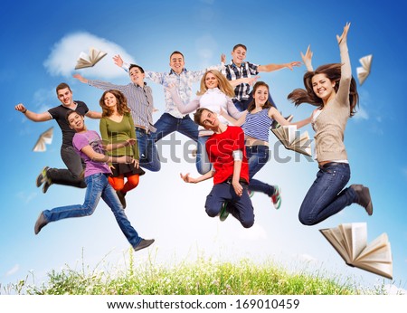 Group happy young people jumping in sky