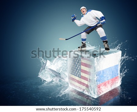 USA - Russia game. Spunky hockey player on ice cube
