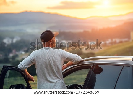 Similar – Image, Stock Photo Car stoped on the road with view of typical rural Icelandic Church with red roof in Vik region. Iceland