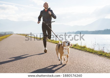 Similar – Foto Bild Sportler laufen auf Asphaltstrasse in den Bergen