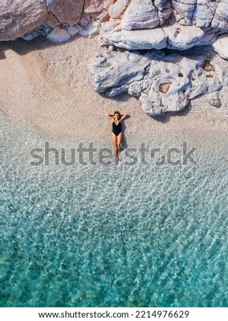 Similar – Image, Stock Photo Person legs on seascape background during sunset