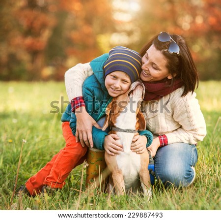 HAppy family autumn portrait - mother with son and pet