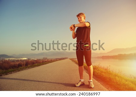 Runner start his watch before training