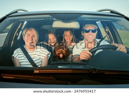 Similar – Foto Bild Paar mit Hund am Sandstrand in der Bretagne mit stürmischem Himmel und Fußspuren im Sand