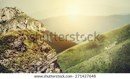 Mountain climber on the top of hill