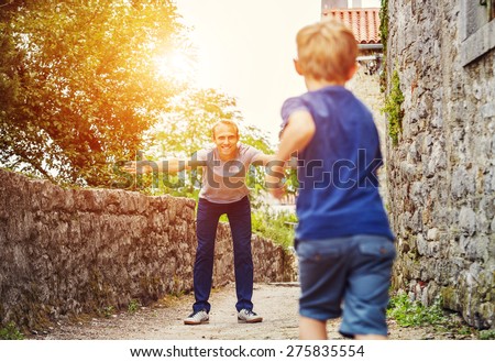 Son runs to his father hugs