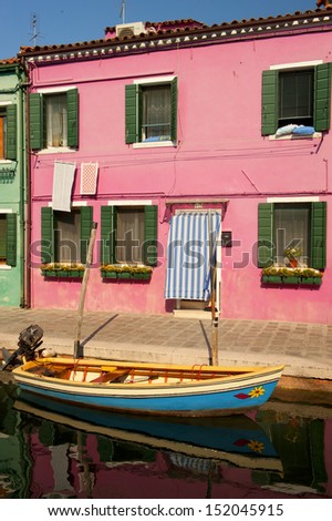 colorful house front on a channel of Burano, venetian island, Venice, Italy