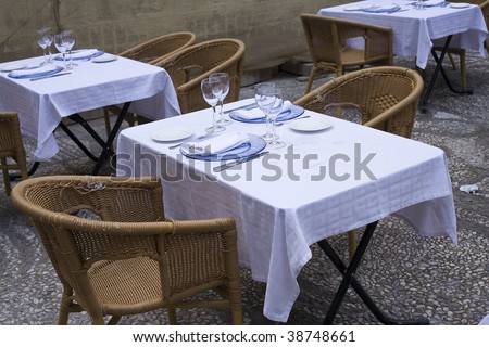 Place settings and a table for two.