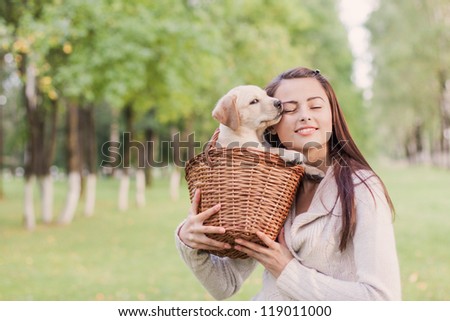 Girl with her dog resting outdoors