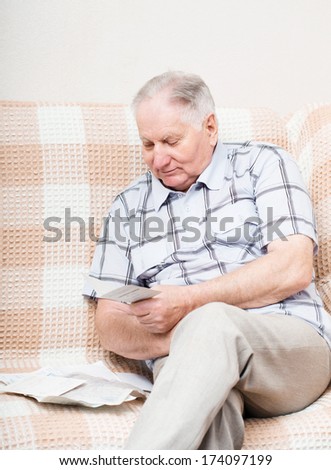 old man reading a document