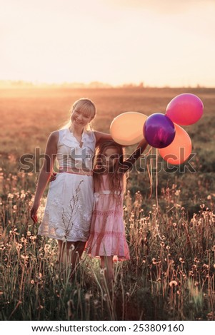 happy family with balloons outdoor