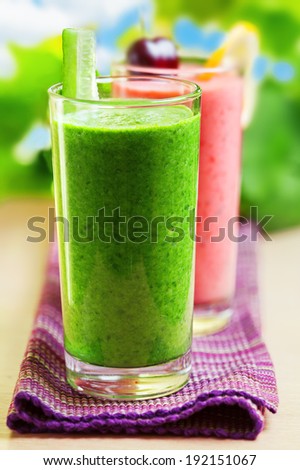 Summer drink, green and pink smoothies, outdoor