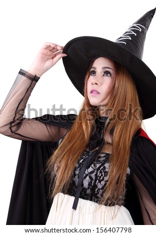 Image of portrait asian woman in black hat and black clothing on halloween