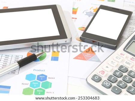 image of pen calculator pen tablet and mobile phone on financial report