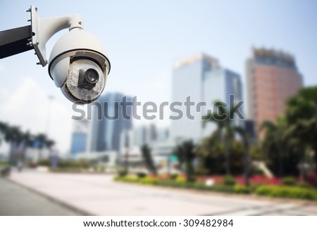 Closeup image of CCTV security camera outdoor in city